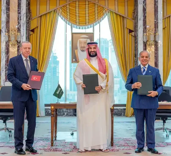 Turkish President Tayyip Erdogan, Saudi Crown Prince Mohammed bin Salman, and Pakistan's Prime Minister Shehbaz Sharif pose after signing a joint defence agreement in Mecca, Saudi Arabia, August 7, 2026.