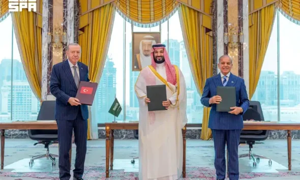 Turkish President Tayyip Erdogan, Saudi Crown Prince Mohammed bin Salman, and Pakistan's Prime Minister Shehbaz Sharif pose after signing a joint defence agreement in Mecca, Saudi Arabia, August 7, 2026.